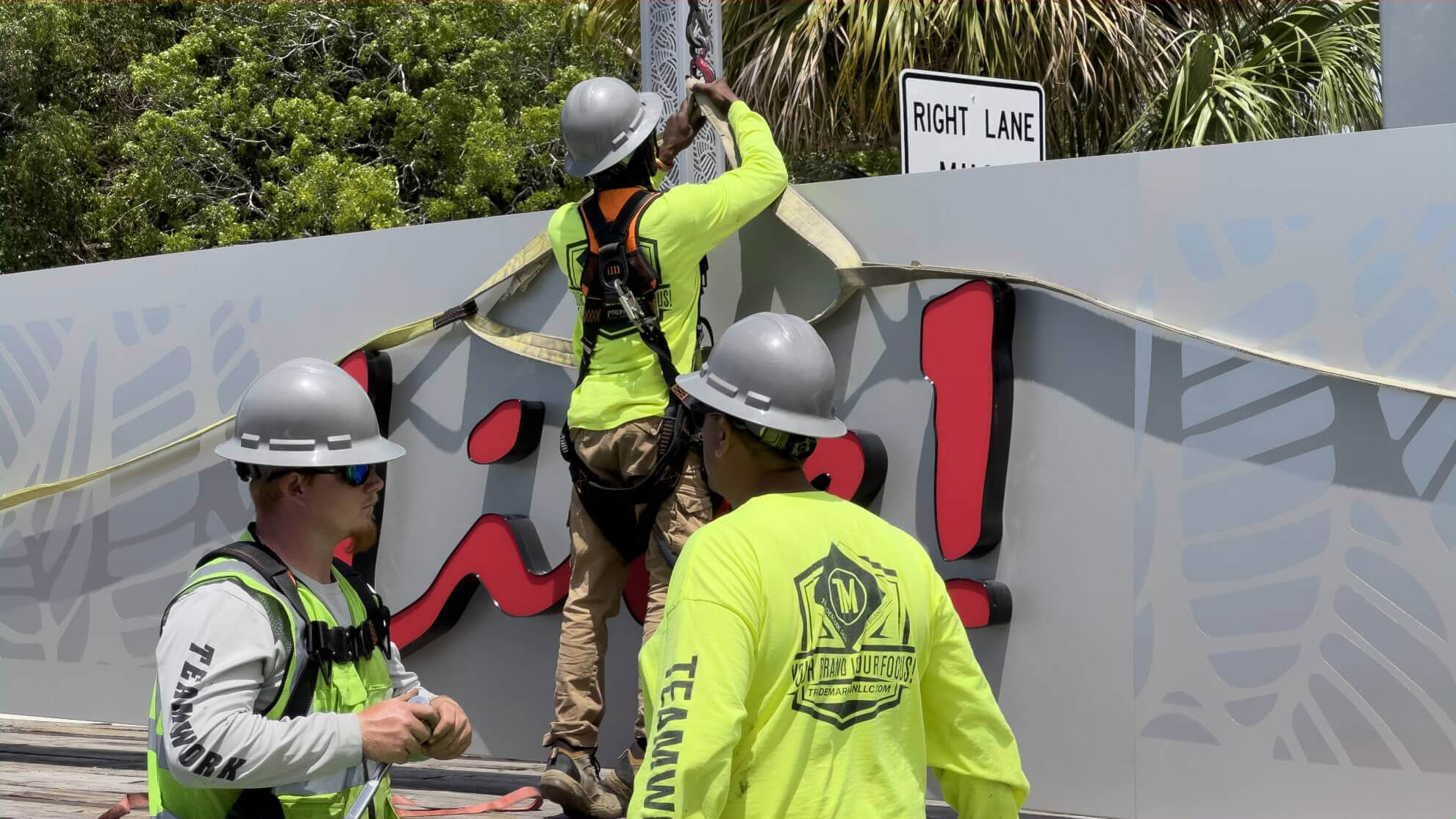 Trademark Sign custom sign installation team installing a Live! sign